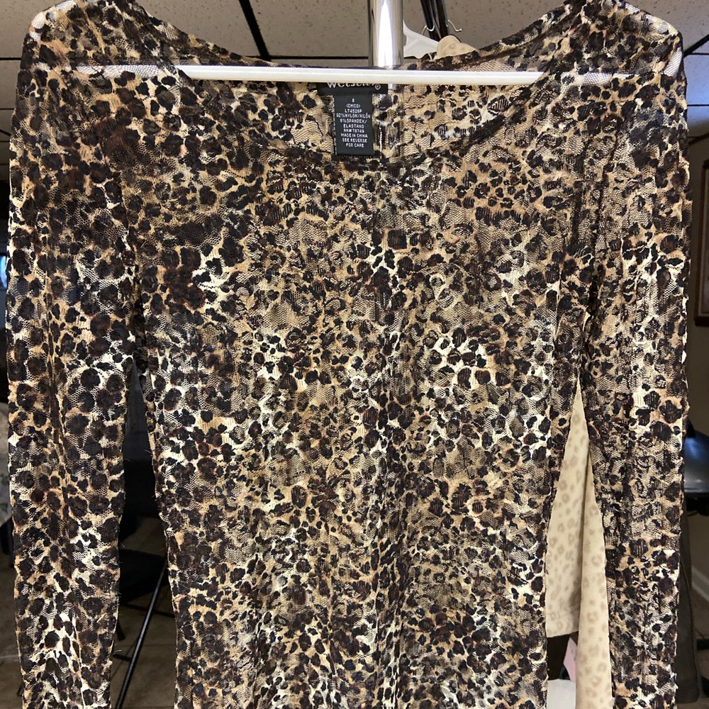 A long sleeve see-through cheetah print shirt size small